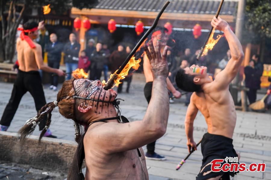 <?php echo strip_tags(addslashes(Performers present a fire stunt show at the Wulingyuan scenic area in Zhangjiajie City, Central China's Hunan Province, Jan. 21, 2019. Zhangjiajie, a UNESCO World Heritage Site, is known for its forest parks and Wulingyuan is famous for its more than 3,000 sandstone pillars. (Photo: China News Service/Yang Huafeng))) ?>