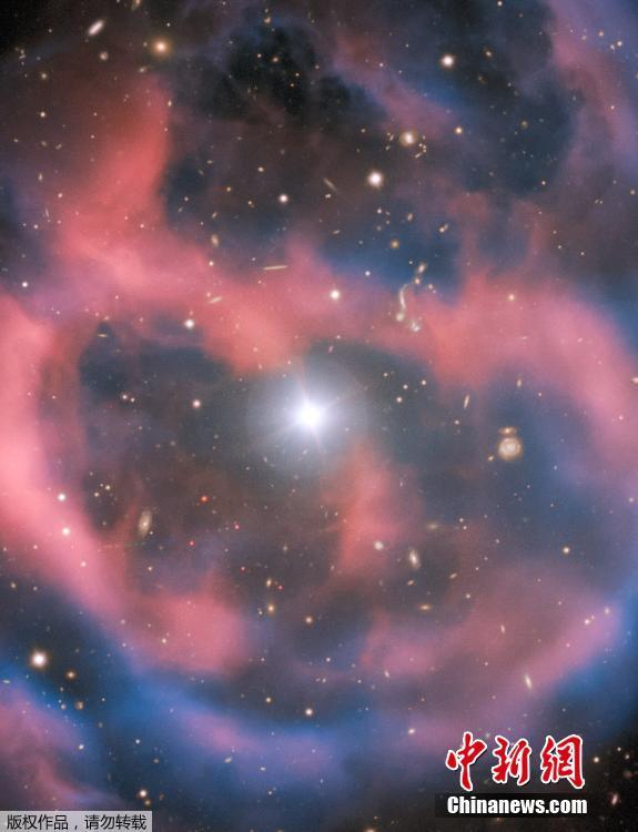 The European Southern Observatory (ESO) has released a beautiful photo taken by its Very Large Telescope (VLT) of a planetary nebula called ESO 577-24,which resides approximately 1,400 light-years away from Earth. The FORS2 instrument captured the bright, central star, Abell 36, as well as the surrounding planetary nebula. The red and blue portions of this image correspond to optical emission at red and blue wavelengths, respectively. An object much closer to home is also visible in this image — an asteroid wandering across the field of view has left a faint track below and to the left of the central star. And in the far distance behind the nebula a glittering host of background galaxies can be seen. (Photo/Agencies)