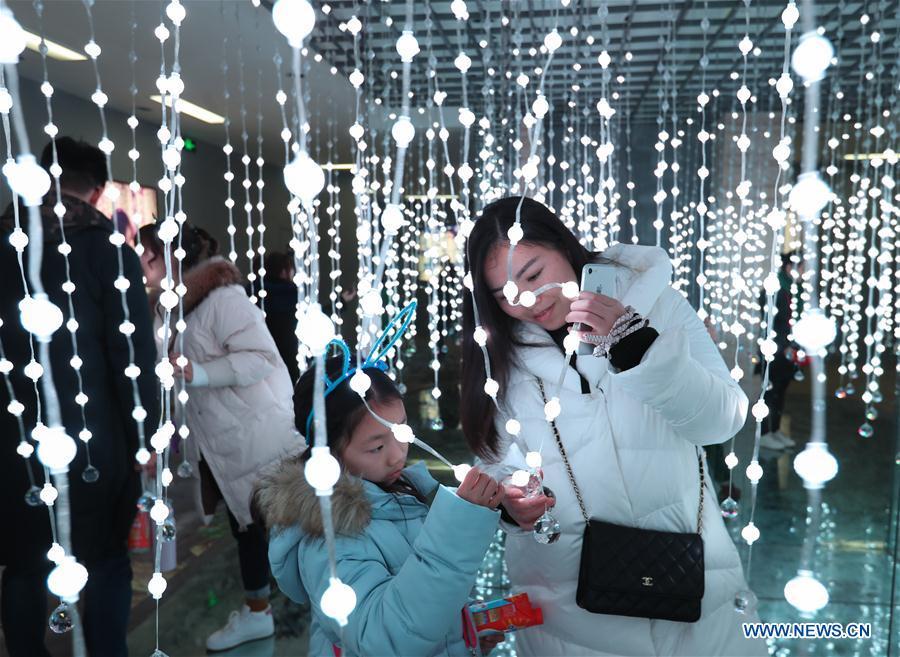 People view lighting beads during a lantern festival in Zigong, southwest China\'s Sichuan Province, Jan. 21, 2019. (Xinhua/Jiang Hongjing)