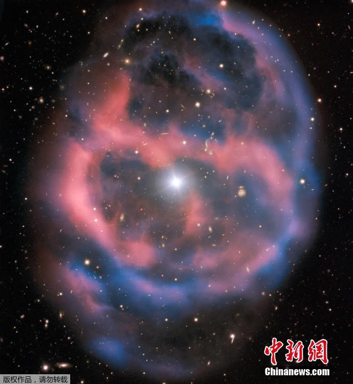 The European Southern Observatory (ESO) has released a beautiful photo taken by its Very Large Telescope (VLT) of a planetary nebula called ESO 577-24,which resides approximately 1,400 light-years away from Earth. The FORS2 instrument captured the bright, central star, Abell 36, as well as the surrounding planetary nebula. The red and blue portions of this image correspond to optical emission at red and blue wavelengths, respectively. An object much closer to home is also visible in this image — an asteroid wandering across the field of view has left a faint track below and to the left of the central star. And in the far distance behind the nebula a glittering host of background galaxies can be seen. (Photo/Agencies)
