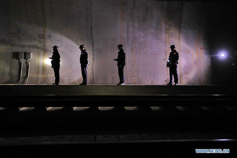Policemen patrol the high-speed railway in Rongjiang County, southwest China\'s Guizhou Province, Jan. 22, 2019. Rongjiang Railway Police Station conducts two or three safety inspections at night every week during the Spring Festival travel rush. (Xinhua/Ou Dongqu)
