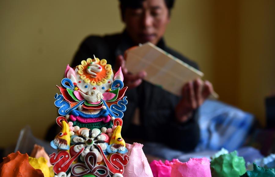 A carefully molded butter figurine pictured in Lhasa, Jan. 22, 2019.  (Photo/Xinhua)