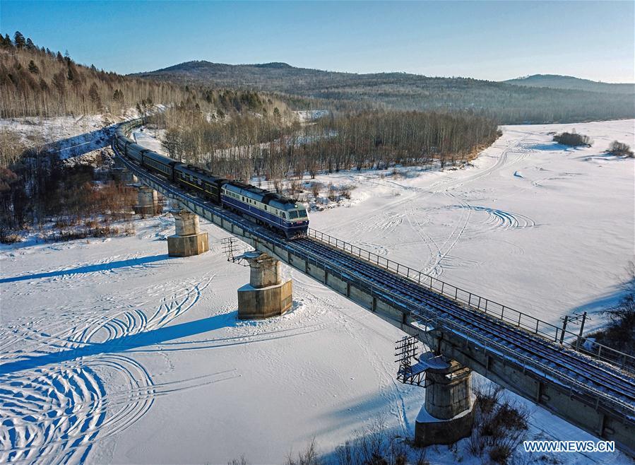 Aerial photo shows train No. K7041 running from Harbin to Mohe in northeast China\'s Heilongjiang Province, Jan. 23, 2019. Train No. K7041 is one of China\'s most economical railway trains which are bound for remote destinations. During China\'s Spring Festival travel season, these \