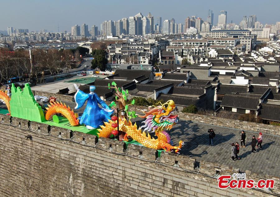 Colored dragon lanterns are installed on the Ming Dynasty (1368-1644) city wall ahead of the Spring Festival, China\'s Lunar New Year, in Nanjing City, Jiangsu Province, Jan. 27, 2019. (Photo: China News Service/Yang Bo)