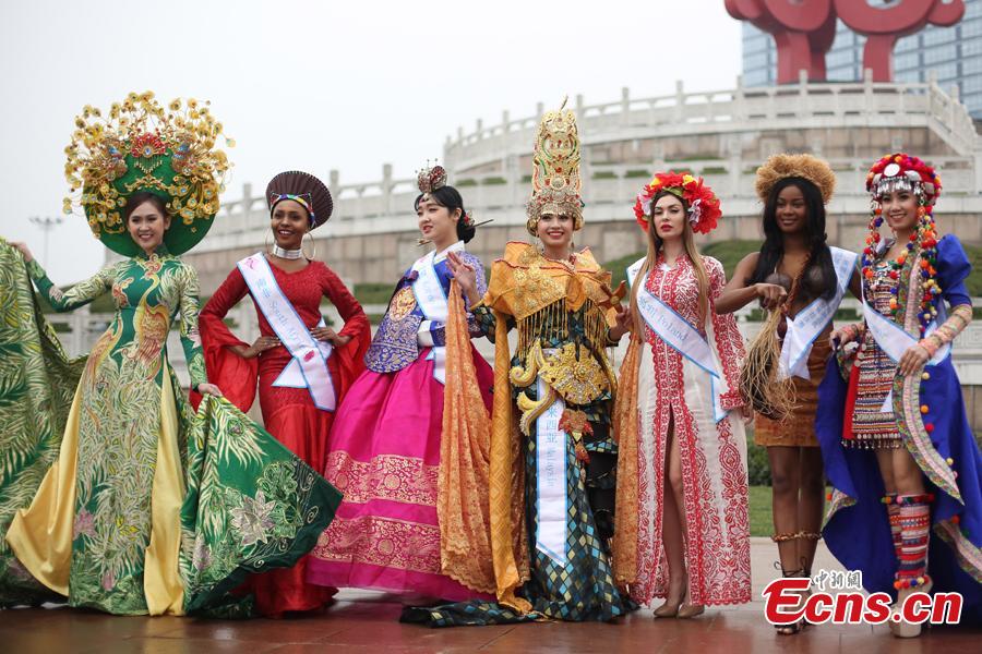 Contestants of the 53rd Miss All Nations Pageant brave the winter chill to pose for a photo in Nanjing, east China\'s Jiangsu Province, Jan. 28, 2019. The pageant will be held on Jan. 29 to promote Eco-Tourism. (Photo: China News Service/Yang Bo)