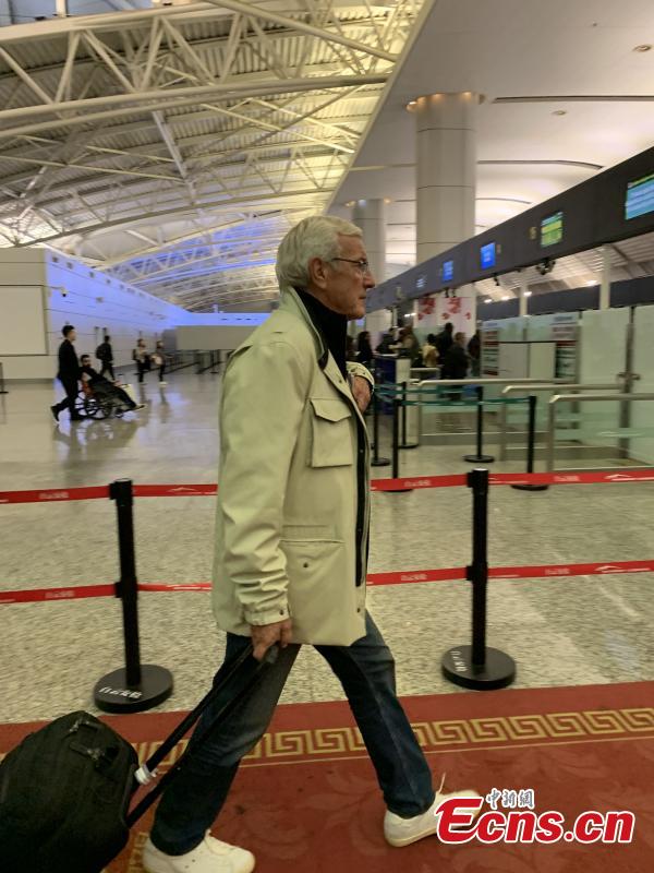 Marcello Lippi, the 70-year-old Italian legendary coach, is seen at Baiyun International Airport in Guangzhou City, Guangdong Province, Jan. 29, 2019. He\'s leaving the country as his contract as China\'s head coach ends after the AFC Asian Cup tour. (Photo/China News Service)