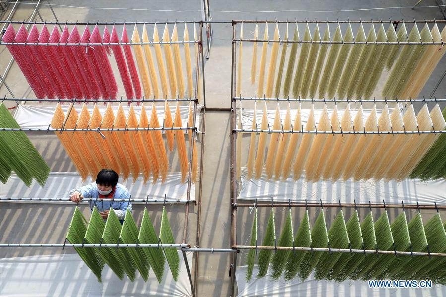<?php echo strip_tags(addslashes(A staff member airs colored noodles at a workshop in Binzhou, east China's Shandong Province, Jan. 29, 2019. These noodles are naturally colored using vegetables or fruits such as carrot, spinach and dragon fruit. (Xinhua/Zhang Chunfeng))) ?>