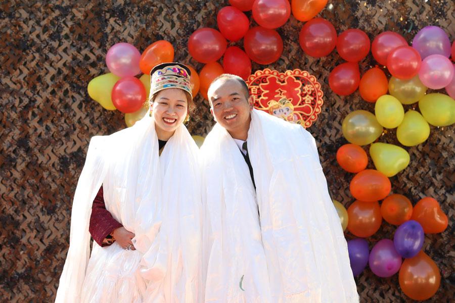 <?php echo strip_tags(addslashes(Wang Mei, 23, from Southwest China's Chongqing, holds a wedding ceremony with her husband Zhang Jinyuan, 30, at a frontier post in Yumai, Tibet autonomous region on January 13, 2019. (Photo provided to chinadaily.com.cn)<br><br>

Wang, 23, hadn't seen her husband for about eight months, so decided to pay him a visit before Spring Festival, which falls on Feb 4 this year.<br><br>

