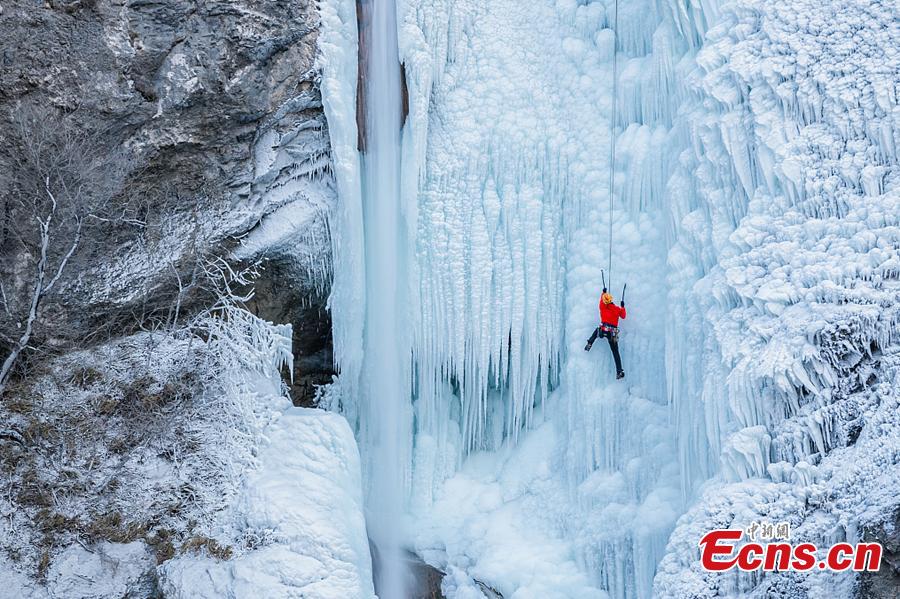 Climbers ascend the ice Torrente Rosandra waterfall, frozen first time in ten years, in Italy, as temperatures dropped to minus seven degrees. (Photo/VCG)