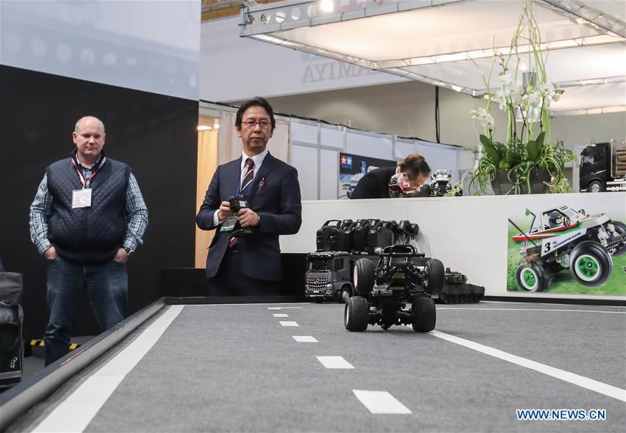 A staff member of the booth of Tamiya demonstrates a remote control vehicle in the Spielwarenmesse exhibition in Nuremberg, Germany, Jan. 30, 2019. Spielwarenmesse, a leading international fair for toys, hobbies and leisure, kicked off in Nuremberg on Wednesday. Around 2,900 manufacturers from all over the world gathered at the annual trade fair, which will last until Feb. 3 and is expected to attract 71,000 visitors from over 125 nations and regions. (Xinhua/Shan Yuqi)