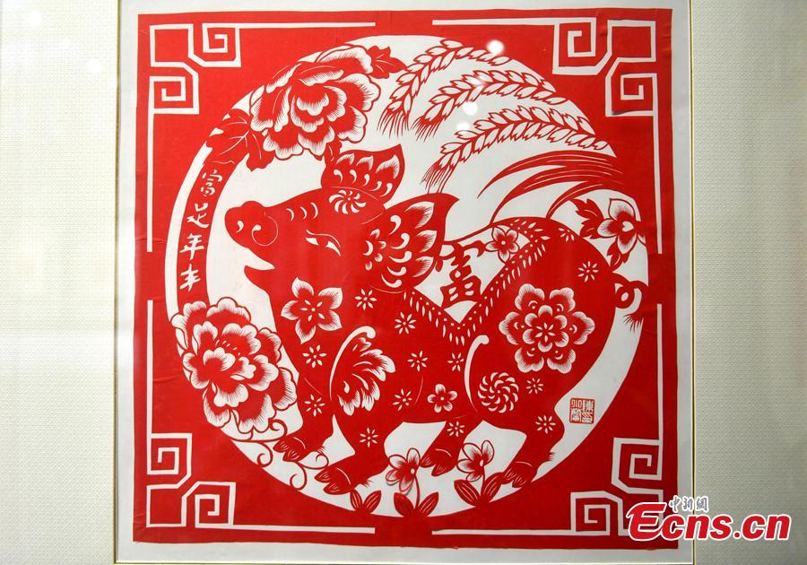 A pig-themed paper-cutting artwork is on display to  celebrate the upcoming Chinese New Year in Fuzhou, Fujian Province, Feb. 1, 2019. The Chinese New Year, or Spring Festival, falls on Feb. 5 this year. The Chinese paper-cutting has a history of more than 1,500 years. It was listed in the UNESCO Intangible Cultural Heritage Lists in 2009. (Photo/China News Service/Lyv Ming)