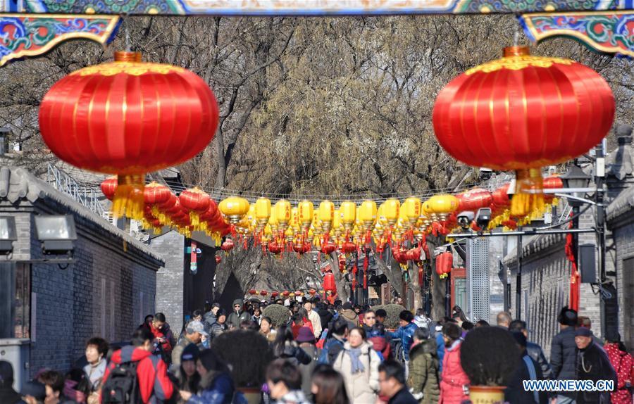 Tourists visit Nanluogu Alley in a festive atmosphere in Beijing, capital of China, Feb. 1, 2019. The city is decorated to greet the coming Chinese Lunar New Year, which falls on Feb. 5 this year. (Xinhua/Li Xin)