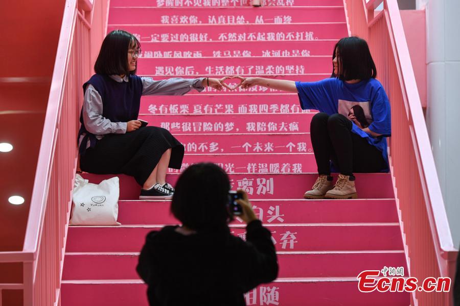 People take photos on pink stairs at the exit of Chunrong Street Subway Station in Kunming City, Southwest China’s Yunnan Province. With cotton clouds suspended in the air and cute love quotes written on the stairs, the pink subway station has quickly gained widespread traction among young people. (Photo: China News Service/Ren Dong)