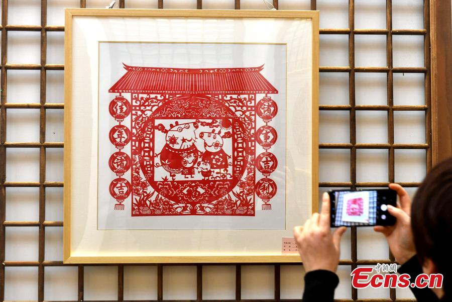 A pig-themed paper-cutting artwork is on display to  celebrate the upcoming Chinese New Year in Fuzhou, Fujian Province, Feb. 1, 2019. The Chinese New Year, or Spring Festival, falls on Feb. 5 this year. The Chinese paper-cutting has a history of more than 1,500 years. It was listed in the UNESCO Intangible Cultural Heritage Lists in 2009. (Photo/China News Service/Lyv Ming)
