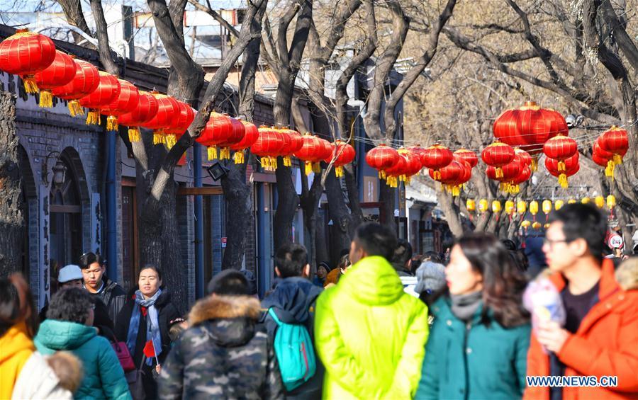 Tourists visit Nanluogu Alley in a festive atmosphere in Beijing, capital of China, Feb. 1, 2019. The city is decorated to greet the coming Chinese Lunar New Year, which falls on Feb. 5 this year. (Xinhua/Li Xin)
