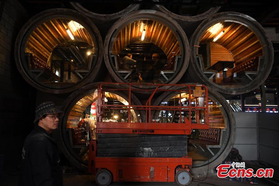 <?php echo strip_tags(addslashes(Photo taken on Feb. 1, 2019 in Chongqing's Liangjiang New Area shows the decor of a café featuring cement pipes and local dialects.  (Photo: China News Service/Chen Chao))) ?>