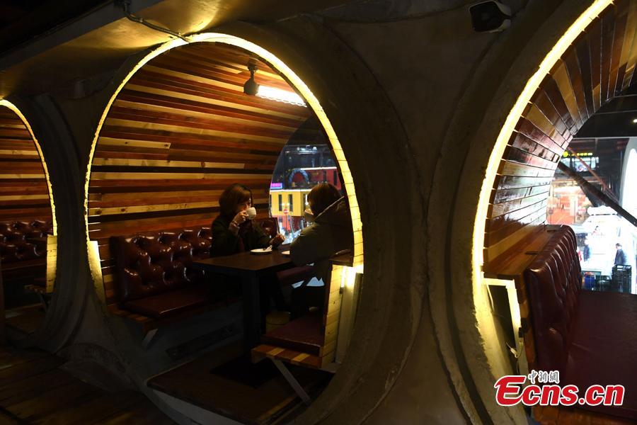 <?php echo strip_tags(addslashes(Photo taken on Feb. 1, 2019 in Chongqing's Liangjiang New Area shows the decor of a café featuring cement pipes and local dialects.  (Photo: China News Service/Chen Chao))) ?>
