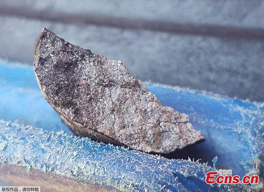 Handout picture released by Tele Pinar showing an alleged piece of a meteorite that fell in Cuba on February 1, 2019, taken in Vinalez, in the Cuban western province of Pinar del Rio. - The fall of a meteorite caused a strong explosion preceded by a flash that shook several municipalities in the Cuban province of Pinar del Rio, according to a member of the state astronomy institute.(Photo/Agencies)