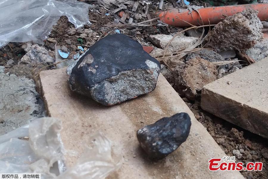 Handout picture released by Tele Pinar showing two alleged pieces of a meteorite that fell in Cuba on February 1, 2019, taken in Vinalez, in the Cuban western province of Pinar del Rio. The fall of a meteorite caused a strong explosion preceded by a flash that shook several municipalities in the Cuban province of Pinar del Rio, according to a member of the state astronomy institute. (Photo/Agencies)
