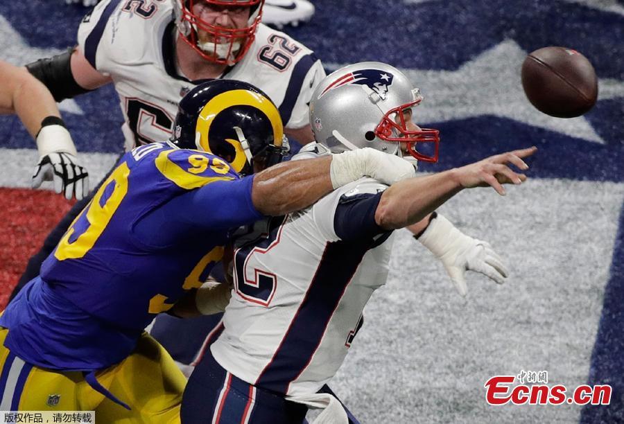 Los Angeles Rams\' Aaron Donald (99) hits New England Patriots\' Tom Brady (12) during the first half of the NFL Super Bowl 53 football game Sunday, Feb. 3, 2019, in Atlanta. The New England Patriots beat the Los Angeles Rams 13-3 on Sunday to capture a National Football League record-tying sixth Super Bowl title.(Photo/Agencies)