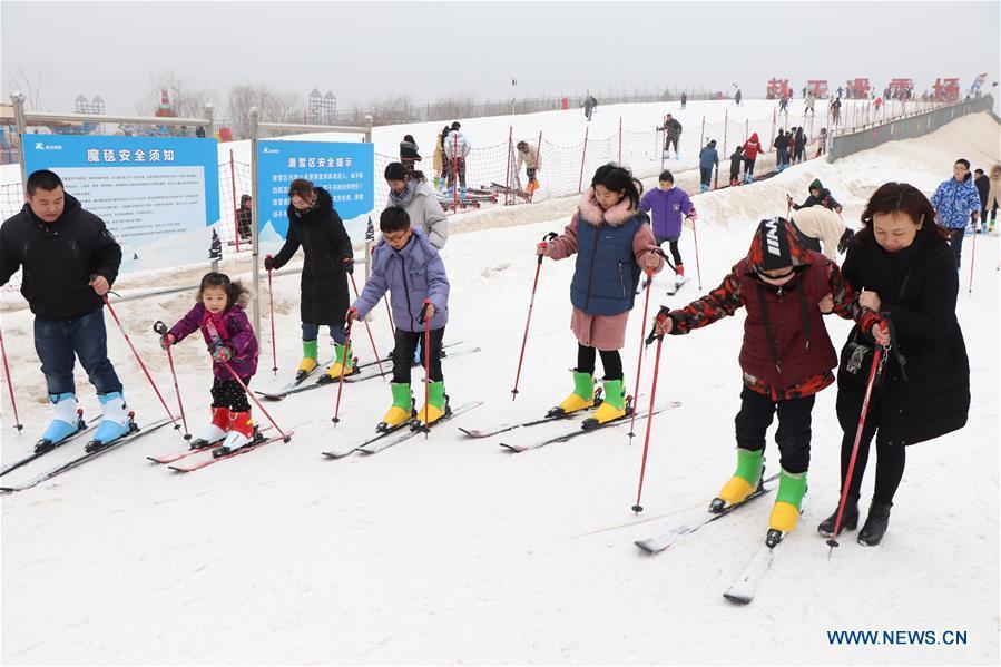 People ski at a ski ranch in Guangping County of Handan City, north China\'s Hebei Province, Feb. 6, 2019, the second day of the Spring Festival. Many enthusiasts enjoy skiing as a way to celebrate the Spring Festival. (Xinhua/Cheng Xuehu)
