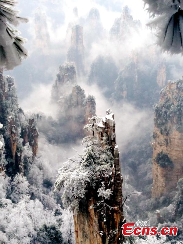 <?php echo strip_tags(addslashes(Mountains and plants are covered with ice as clouds float by at the Tianzi Mountain scenic area in Zhangjiajie City, Central China's Hunan Province, Feb. 11, 2019. (Photo: China News Service/Deng Daoli))) ?>