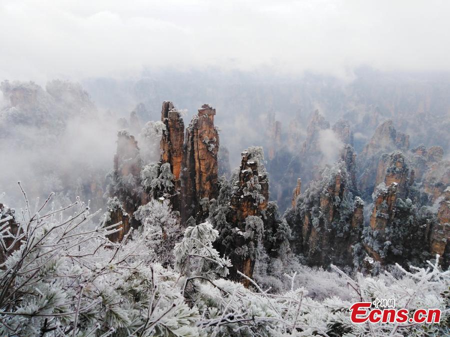 <?php echo strip_tags(addslashes(Mountains and plants are covered with ice as clouds float by at the Tianzi Mountain scenic area in Zhangjiajie City, Central China's Hunan Province, Feb. 11, 2019. (Photo: China News Service/Deng Daoli))) ?>