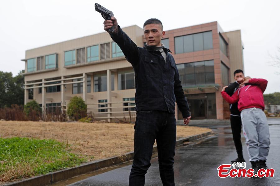 Members of the armed police take part in a drill simulating a hostage-taking scenario at Zhangjiang Hi-Tech Park in Pudong, Shanghai, February 12, 2019. The drill was organized to enhance emergency preparedness. (Photo: China News Service/Yin Liqin)