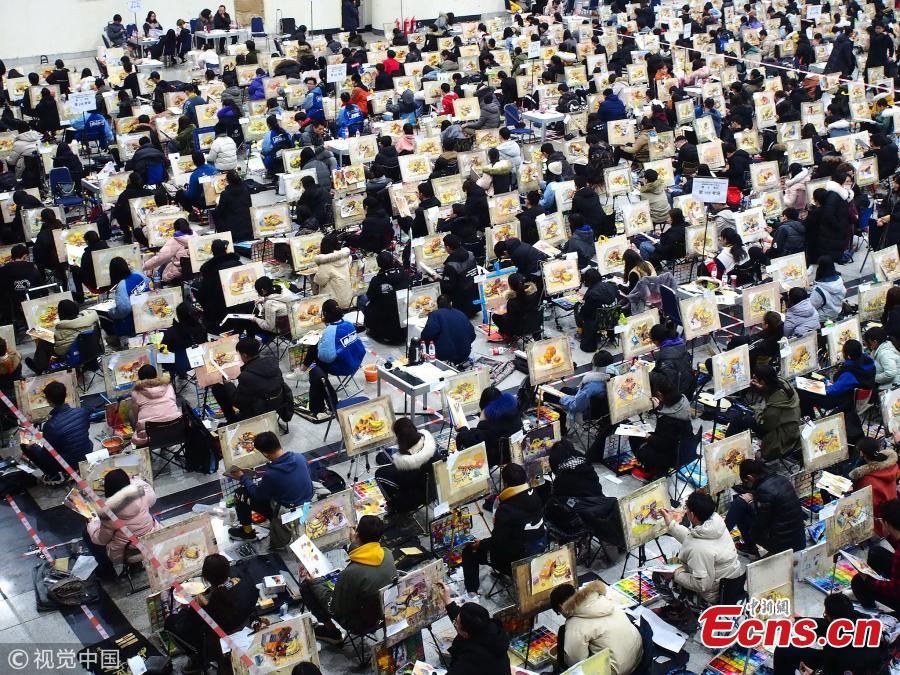 Students sit the entrance exam for Shandong University of Art & Design in Jinan City, East China\'s Shandong Province, Feb. 13, 2019. More than 6,500 students took the test, which applied face recognition and fingerprint checks to prevent fraud. (Photo/VCG)