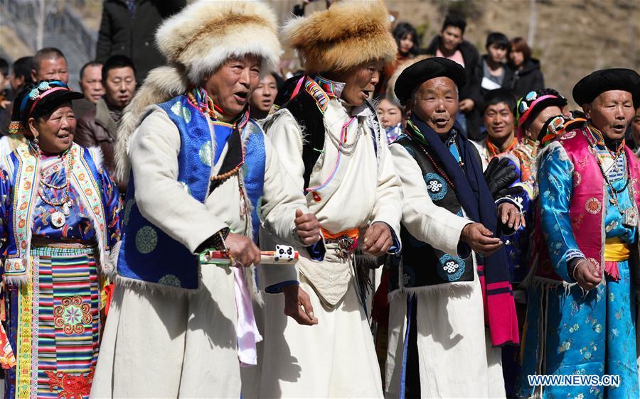 People of Tibetan ethnic group perform during the Shangjiu Festival at the foot of Jiajin Mountain in the Tibetan Township of Qiaoqi in Ya\'an City, southwest China\'s Sichuan Province, Feb. 13, 2019. The Shangjiu Festival, a traditional festival of the Tibetan people, is celebrated on the ninth day of the first lunar month to pray for a good harvest. (Xinhua/Jiang Hongjing)