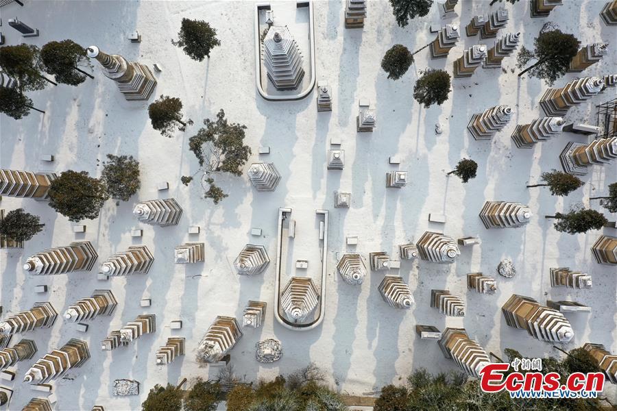 Aerial photo taken on Jan. 10, 2019 shows the snow-covered Pagoda Forest of Shaolin Temple in Dengfeng City, central China\'s Henan Province. (Xinhua/Feng Dapeng)