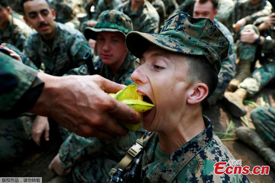 A soldier eats a Carambola (star fruit) during the Cobra Gold multilateral military exercise in Chanthaburi, Thailand, Feb. 14, 2019. (Photo/Agencies)