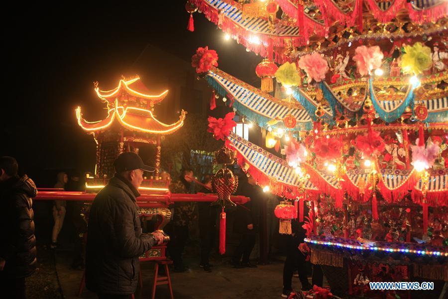 <?php echo strip_tags(addslashes(Villagers participate in the ornamental dragon parade in Xiliuzhai Village of Beibaixiang Town of Yueqing, east China's Zhejiang Province, Feb. 12, 2019. Having a history of more than 400 years, the ornamental dragon, a sacrifice to pray for good fortune during the period of Lantern Festival, is popular in villages of Yueqing City in Zhejiang Province. Lin Shunkui, an inheritor of the handicraft of ornamental dragon, is born in 1956 in Dongchan Village of Beibaixiang Town. Learning the art since he was young from his father, who is a master of fine paper-cutting, Lin has been in the walk for more than 40 years and has been famous for his exquisite handicraft. The making procedures of the ornamental dragon require high standards and needs preparation of more than half a year. The craftsman must be proficient in various vocations such as paper-cutting, carpentry, painting and machinery. Usually having a height of four meters, a length of three meters and a width of two meters, the ornamental dragon displays about 300 figures in more than 80 cabinets, which are driven by gears hidden inside the dragon body. The handicraft of ornamental dragon was listed as one of the national intangible cultural heritages in October of 2014. (Xinhua/Zhu Weixi))) ?>