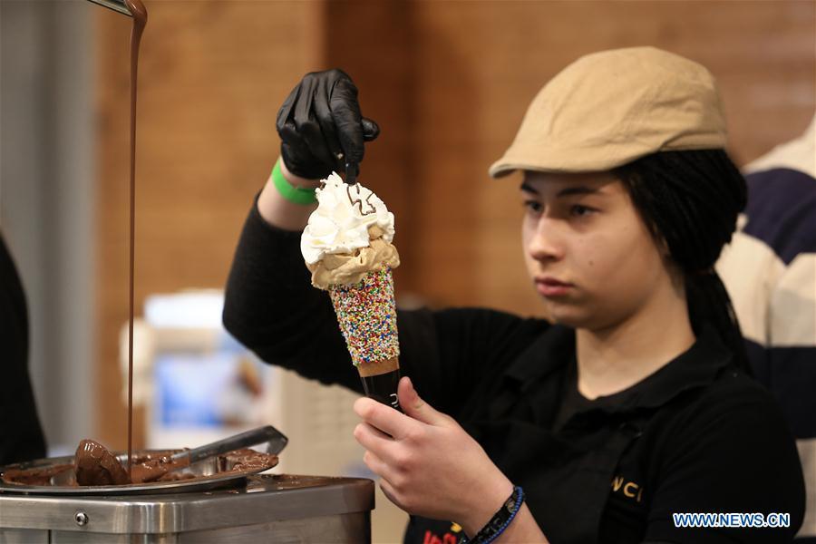 <?php echo strip_tags(addslashes(A worker makes an ice cream during the Chocolate Festival in Athens, Greece, Feb. 16, 2019. The four-day festival, held from February 14 to 17, involved tasting sessions, workshops and children activities led by experts dedicated to the art of chocolate. (Xinhua/Marios Lolos))) ?>