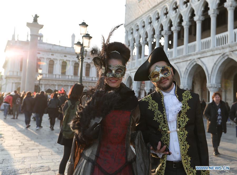 Revelers pose during the Venice Carnival in Venice, Italy, on Feb. 17, 2019. The Venice Carnival 2019 kicked off on Saturday and will last until March 5. (Xinhua/Cheng Tingting)