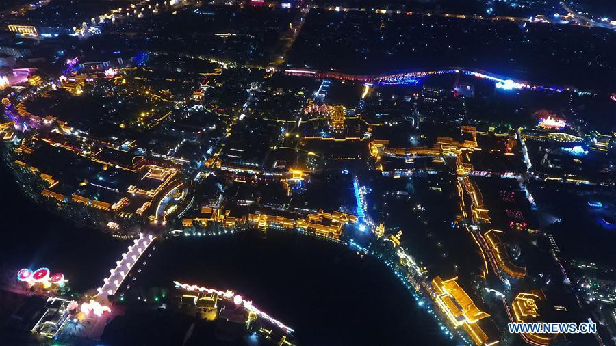 <?php echo strip_tags(addslashes(Aerial photo taken on Feb. 16, 2019 shows the night view of the ancient town of Taierzhuang in east China's Shandong Province. (Xinhua/Wang Kai))) ?>