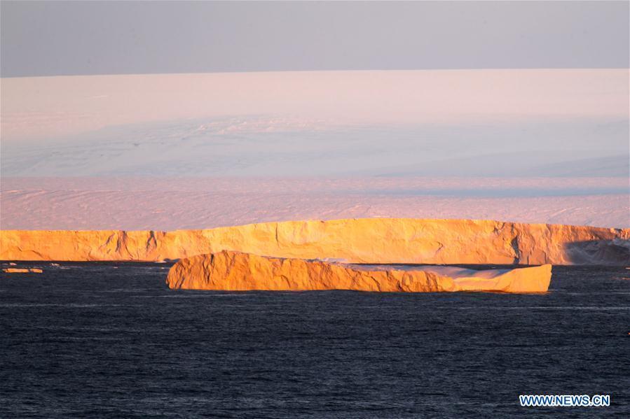 Photo taken on Feb. 13, 2019 shows the edge of the Antarctic ice sheet and an iceberg on the sea near the Zhongshan Station, a Chinese research base in Antarctica. The Zhongshan Station was set up in February 1989. Within tens of kilometers to the station, ice sheets, glacier and iceberg can all be seen. (Xinhua/Liu Shiping)
