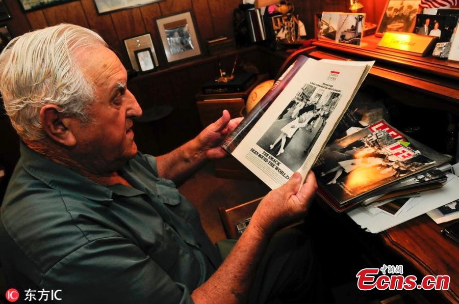 George Mendonsa, 89, holds one of the most iconic photographs of the 20th century at his Middletown, Rhode Island home, Oct. 23, 2012. In the photograph, Mendonsa is widely believed to be the sailor kissing an unsuspecting nurse (actually a dental hygienist) on V-E Day in Times Square in 1945. The photograph was taken by Life Magazine photographer Alfred Eisenstaedt. George Mendonsa has died at the age of 95. (Photo/Agencies)