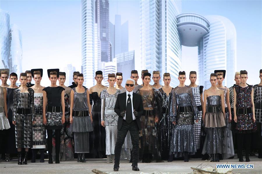 File photo taken on July 3, 2013 shows Fashion designer Karl Lagerfeld at the end of his Haute Couture Fall Winter 2013/2014 fashion show for French fashion house Chanel in Paris, France. German Fashion designer Karl Lagerfeld died in Paris at the age of 85 on Tuesday. (Xinhua/Gao Jing)