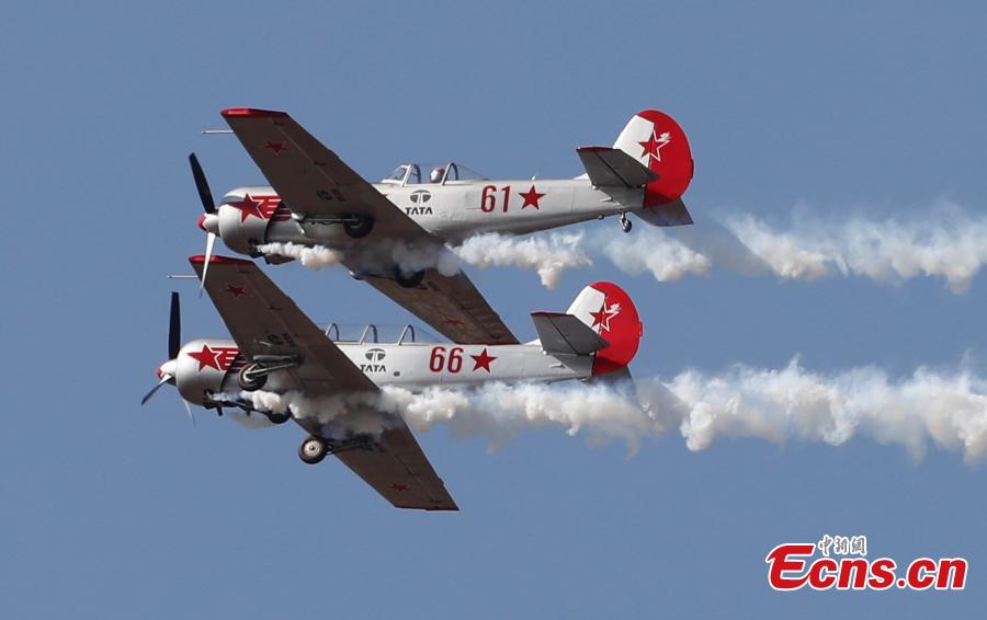 <?php echo strip_tags(addslashes(The Yakovlevs, a U.K. based aerobatic team flying Russian designed Yakovlev aircrafts, perform aerobatic maneuvers on the inaugural day of Aero India 2019 at Yelahanka air base in Bangalore, India, Wednesday, Feb. 20, 2019. Over 400 exhibitors from more than 20 countries and regions are participating in Aero India show this year. (Photo/Agencies))) ?>