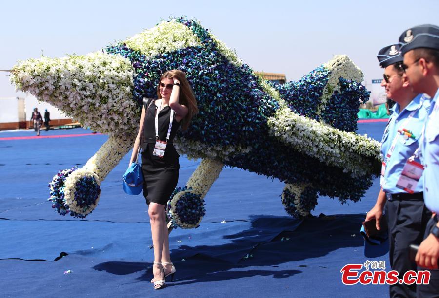<?php echo strip_tags(addslashes(A foreign exhibitor poses next to a floral aircraft model on the inaugural day of Aero India 2019 at Yelahanka air base in Bangalore, India, Feb. 20, 2019.  Over 400 exhibitors from more than 20 countries and regions are participating in Aero India show this year. (Photo/Agencies))) ?>