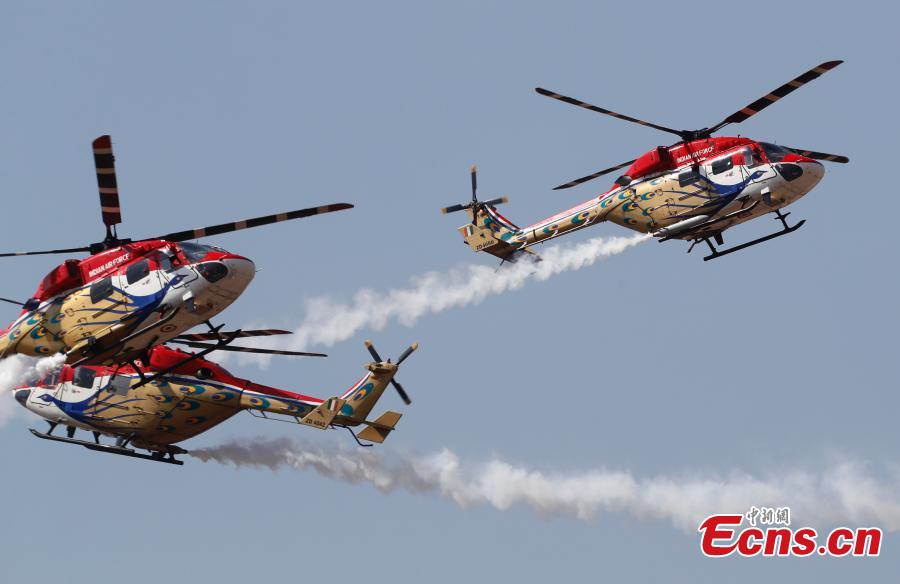 Indigenously manufactured Indian Air Force Dhruv helicopters perform aerobatic maneuvers on the inaugural day of Aero India 2019 at Yelahanka air base in Bangalore, India, Feb. 20, 2019. Over 400 exhibitors from more than 20 countries and regions are participating in Aero India show this year. (Photo/Agencies)