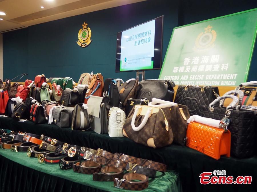 Counterfeit products, including purses and scarves, are on show at a press conference held by the Customs and Excise Department, Hong Kong, Feb. 21, 2019. The department\'s Intellectual Property Investigation Bureau has seized approximately 5,000 fake branded products in five stores and warehouses, with a market value of about three million HK dollars ($382,287), and also detained six suspects. (Photo: China News Service/Hong Shaokui)Counterfeit products, including purses and scarves, are on show at a press conference held by the Customs and Excise Department, Hong Kong, Feb. 21, 2019. The department\'s Intellectual Property Investigation Bureau has seized approximately 5,000 fake branded products in five stores and warehouses, with a market value of about three million HK dollars ($382,287), and also detained six suspects. (Photo: China News Service/Hong Shaokui)