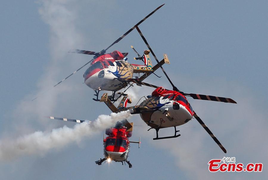 Indigenously manufactured Indian Air Force Dhruv helicopters perform aerobatic maneuvers on the inaugural day of Aero India 2019 at Yelahanka air base in Bangalore, India, Feb. 20, 2019. Over 400 exhibitors from more than 20 countries and regions are participating in Aero India show this year. (Photo/Agencies)