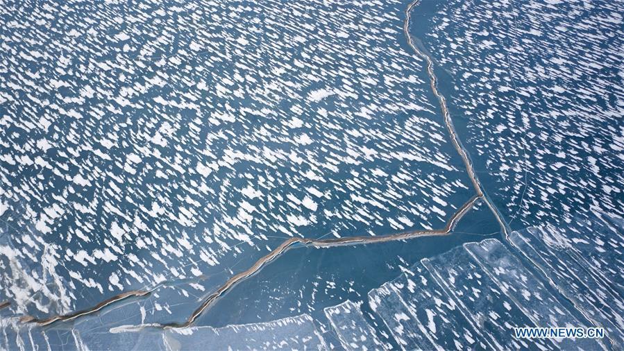 <?php echo strip_tags(addslashes(Aerial photo taken on Dec. 28, 2016 shows the scenery of ice floating on Qinghai Lake in northwest China's Qinghai Province. China's largest inland saltwater lake saw its water level rise 0.48 meters in 2018 as a result of increased rainfall, the local meteorological center said. Qinghai Lake, situated in northwest China's Qinghai Province, has been expanding since 2005. The water level rose to 3,195.41 meters at the end of last year, according to the Qinghai hydrology and water resources investigation bureau. Experts said the rising level of the lake could help increase the area's humidity and temperature, which contributes to the improvement of the region's wildlife habitat and ecosystem. (Xinhua/Wu Gang))) ?>
