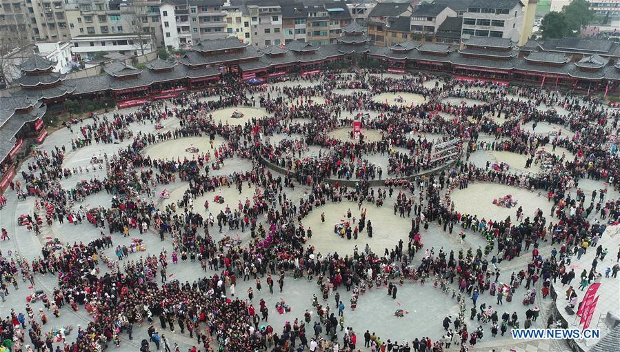 <?php echo strip_tags(addslashes(Aerial photo taken on Feb. 24, 2019 shows people of the Miao ethnic group performing the lusheng dance in Zhouxi Town, Kaili City of southwest China's Guizhou Province. The ethnic Miao girls donning traditional embroidered attire and silver ornaments sing and dance to the sound of the lusheng, a reed-pipe wind instrument, to pray for a good harvest. Ethnic Miao people get together at Gannangxiang to rejoice in the annual Gannangxiang celebration, one of the largest-scale and most primitive Miao lusheng celebrations in Guizhou Province. (Xinhua/Yang Wenbin))) ?>