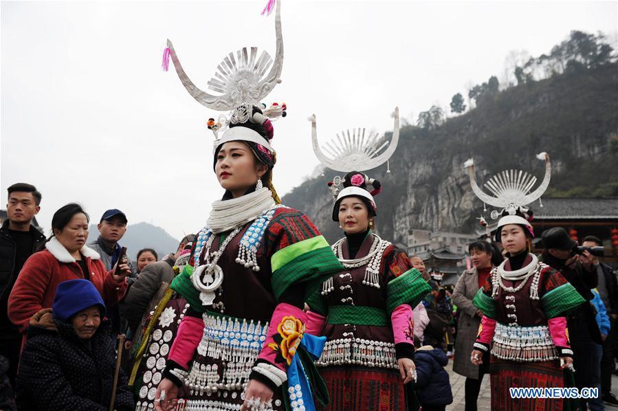 <?php echo strip_tags(addslashes(Villagers in traditional costumes perform the lusheng dance in Zhouxi Town, Kaili City of southwest China's Guizhou Province, Feb. 24, 2019. The ethnic Miao girls donning traditional embroidered attire and silver ornaments sing and dance to the sound of the lusheng, a reed-pipe wind instrument, to pray for a good harvest. Ethnic Miao people get together at Gannangxiang to rejoice in the annual Gannangxiang celebration, one of the largest-scale and most primitive Miao lusheng celebrations in Guizhou Province. (Xinhua/Yang Wenbin))) ?>