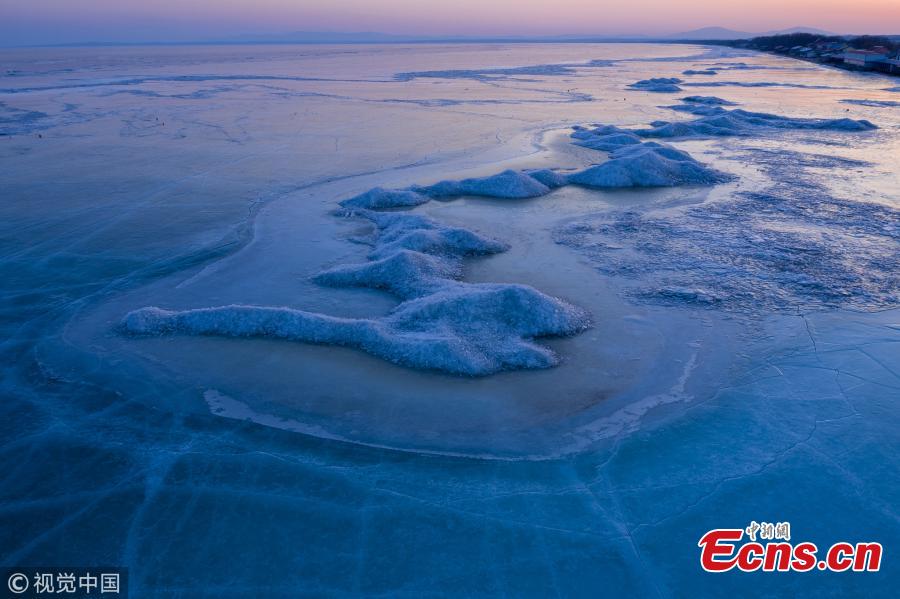 <?php echo strip_tags(addslashes(A view of the frozen Xingkai Lake, a border lake between China and Russia, in Northeast China's Heilongjiang Province, Feb. 23, 2019. The largest freshwater lake in northeast China, Xingkai is well-known for its abundant biodiversity and complex ecosystems. Local authorities are warning tourists the ice in the lake has begun melting earlier than in the past. (Photo/VCG))) ?>