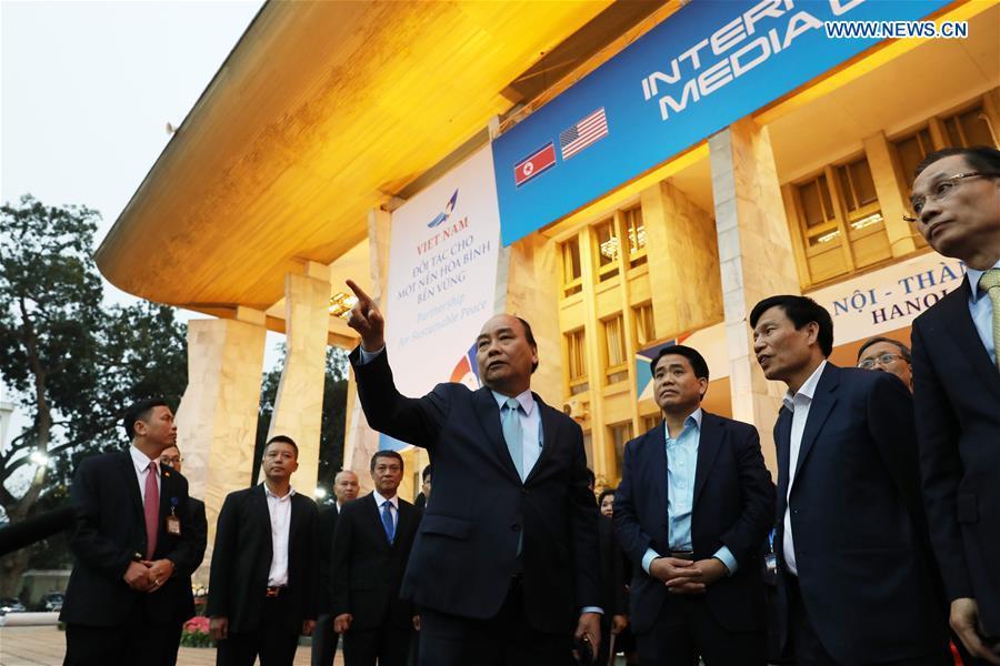 Vietnamese Prime Minister Nguyen Xuan Phuc (2nd L) visits the International Media Center for the second summit between the Democratic People\'s Republic of Korea (DPRK) and the United States in Hanoi, Vietnam, on Feb. 24, 2019. The second DPRK-U.S. summit is scheduled to be held in Hanoi on Feb. 27-28. (Xinhua/Wang Di)
