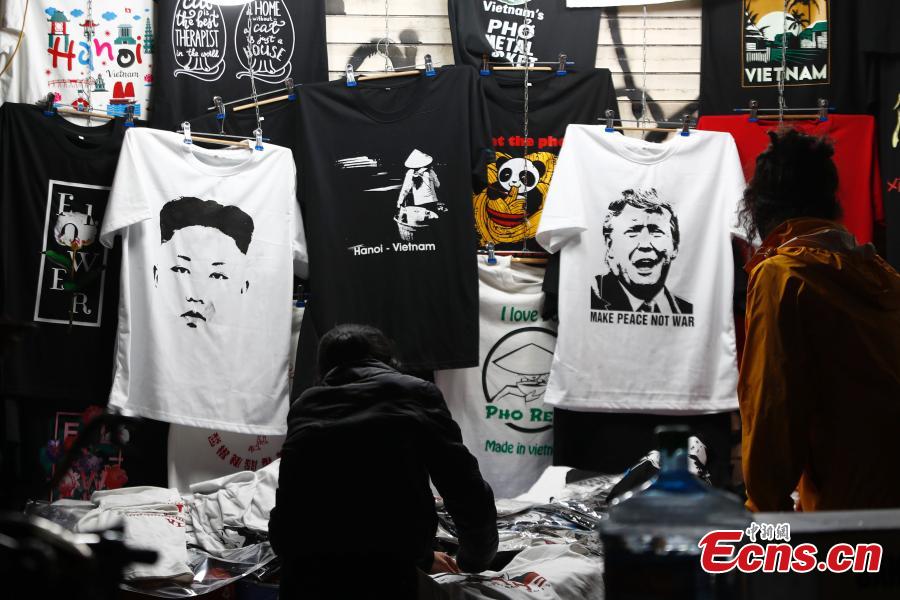 T-shirts emblazoned with depictions of Kim Jong Un, the leader of the Democratic People\'s Republic of Korea, and U.S. President Donald Trump are on display ahead of a summit in Hanoi, Vietnam Feb. 25, 2019. (Photo: China News Service/Fu Tian)